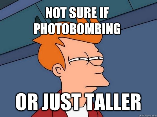Not sure if photobombing Or just taller  Futurama Fry