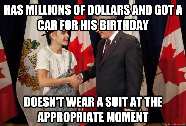 Has millions of dollars and got a car for his birthday Doesn't wear a suit at the appropriate moment  