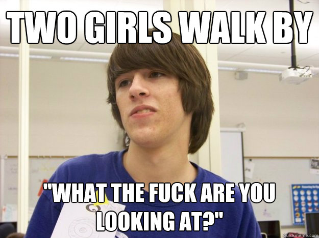 Two girls walk by 