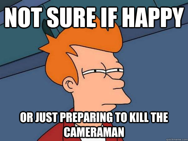 not sure if happy or just preparing to kill the cameraman  Futurama Fry
