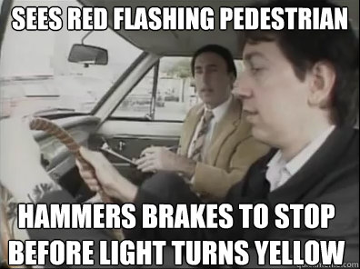 Sees red flashing pedestrian Hammers brakes to stop before light turns yellow  Seattle Driver