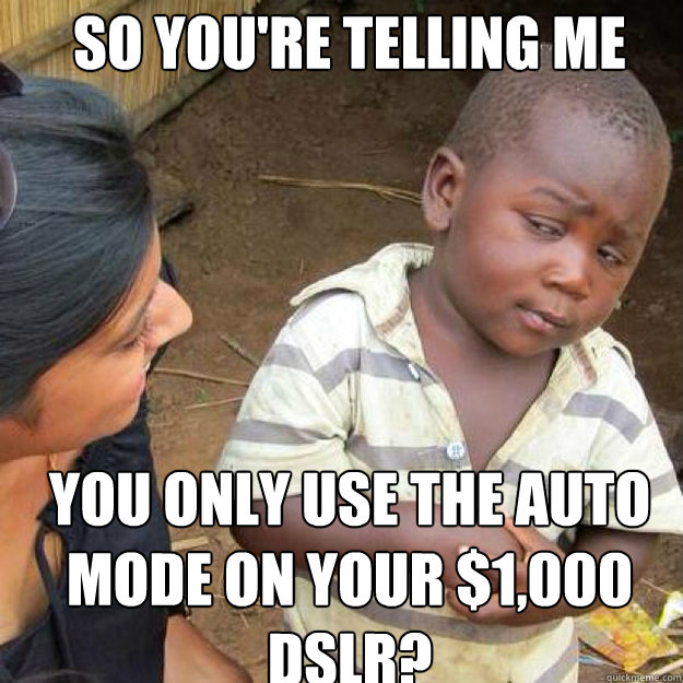 SO YOU'RE TELLING ME you only use the auto mode on your $1,000 dslr?  African kid