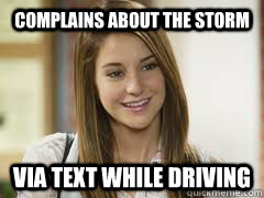 complains about the storm  via text while driving  