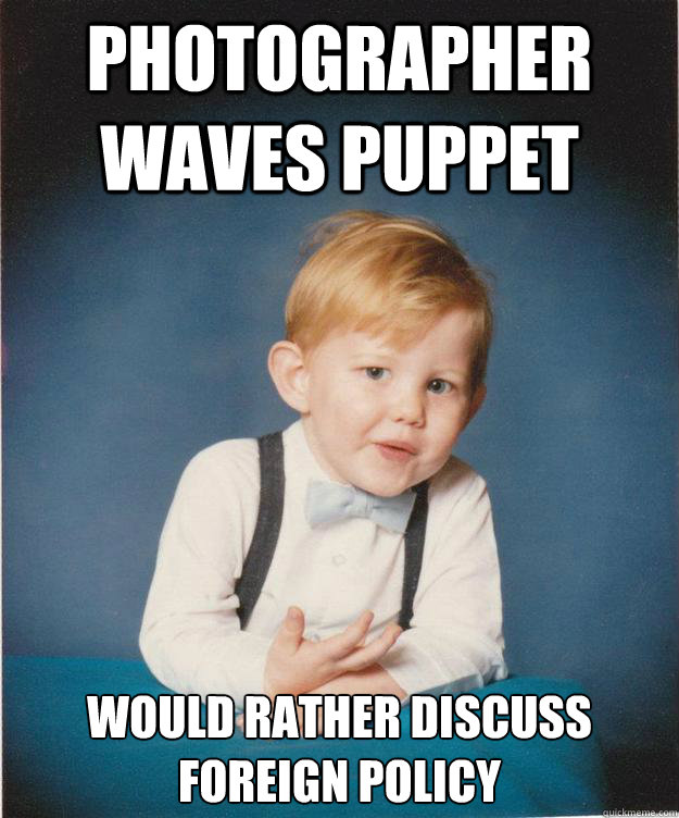 photographer waves puppet would rather discuss foreign policy  