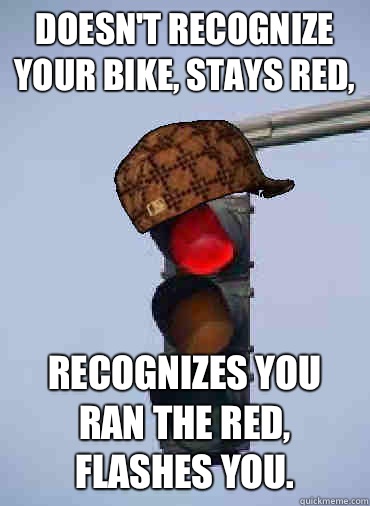 Doesn't recognize your bike, stays red, Recognizes you ran the red, flashes you.  