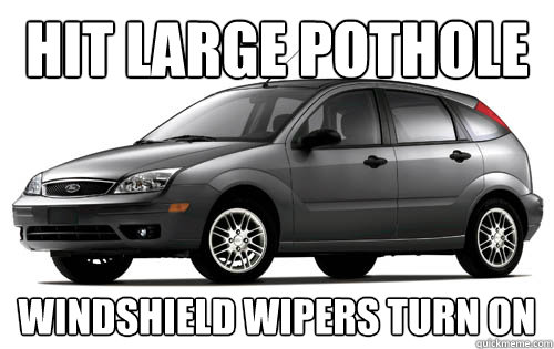 Hit large pothole Windshield wipers turn on  Ford Focus