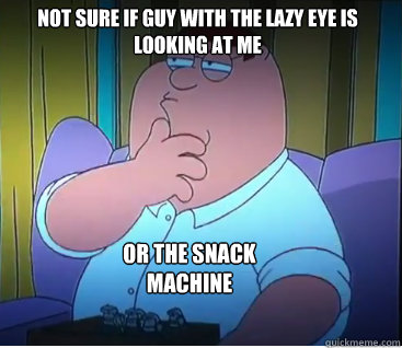 Not sure if guy with the lazy eye is looking at me Or the snack machine  