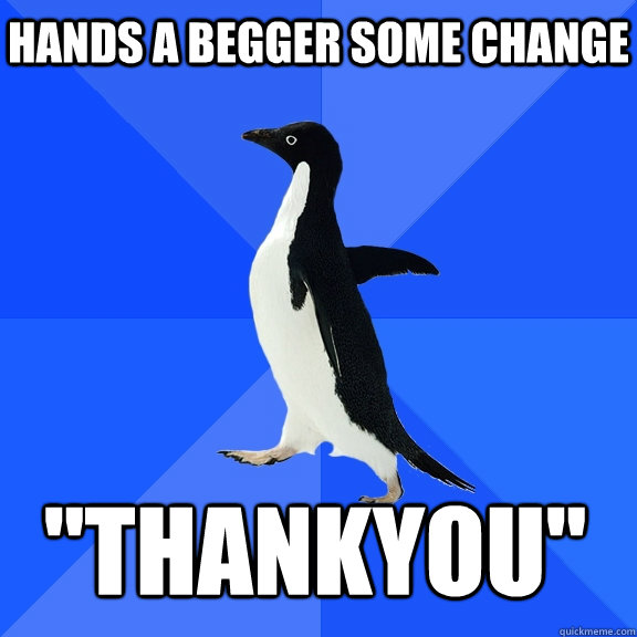 Hands a begger some change 