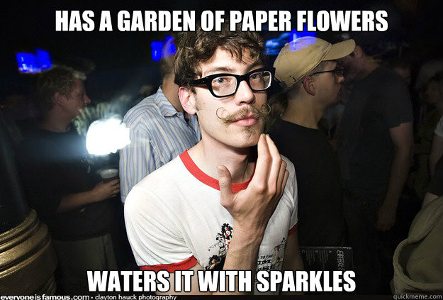 Has a garden of paper flowers waters it with sparkles  
