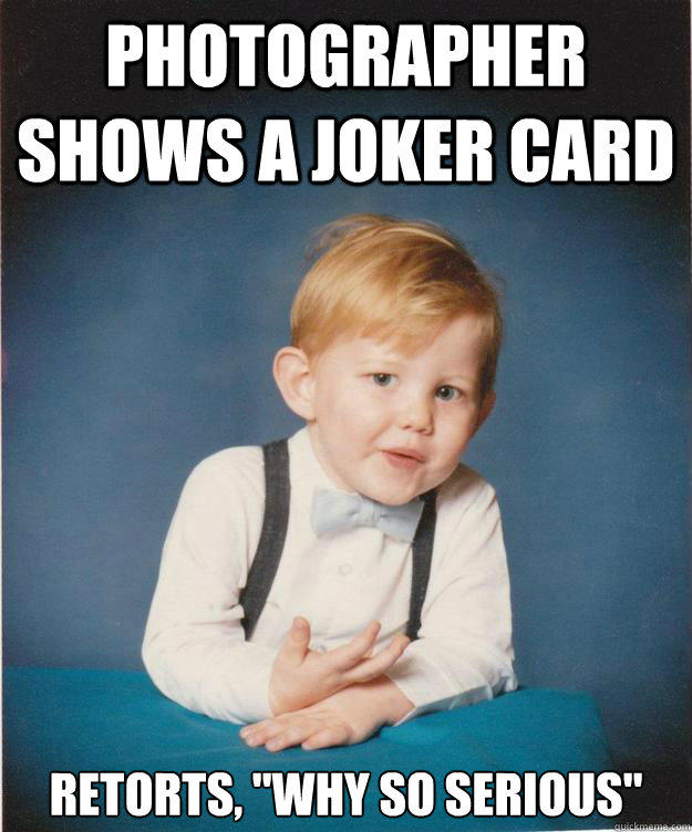 photographer shows a joker card retorts, 