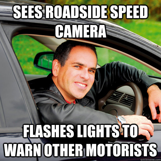 sees roadside speed camera flashes lights to warn other motorists  