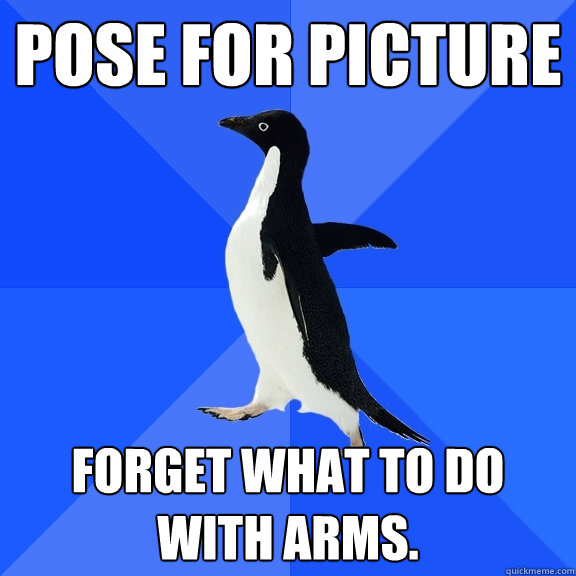 Pose for picture forget what to do with arms.  Socially Awkward Penguin