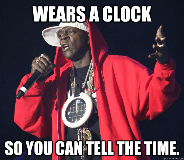 Wears A Clock  So You Can Tell The Time.  Flava Flav