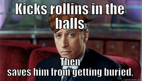 KICKS ROLLINS IN THE BALLS THEN SAVES HIM FROM GETTING BURIED. Scumbag Jon Stewart