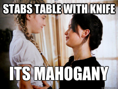 Stabs table with knife Its mahogany  