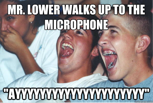 Mr. Lower walks up to the microphone 