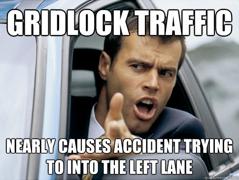 Gridlock traffic nearly causes accident trying to into the left lane  Asshole driver