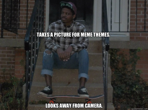 Takes a picture for meme themes. Looks away from camera.  