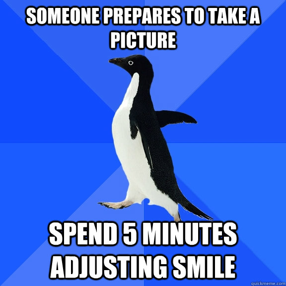 someone prepares to take a picture spend 5 minutes adjusting smile  Socially Awkward Penguin