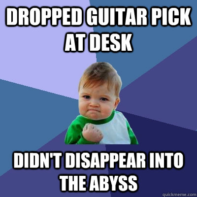 dropped guitar pick at desk didn't disappear into the abyss  Success Kid