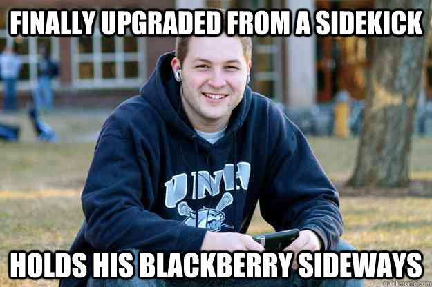 Finally Upgraded from a Sidekick Holds his Blackberry sideways  Successful College Senior