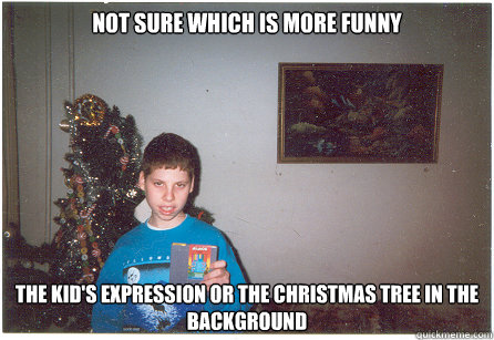 Not Sure Which is More Funny The kid's expression or the Christmas Tree in the background  Getting a Christmas Gift