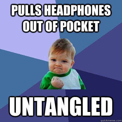 Pulls headphones out of pocket untangled  