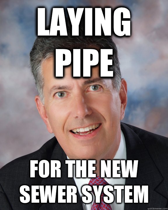 Laying pipe For the new sewer system  Overly Attached Mayor Ellis