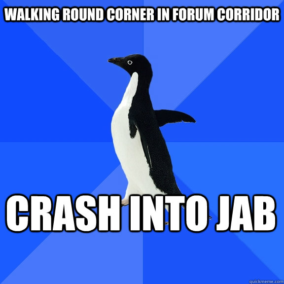 Walking round corner in forum corridor Crash into jab    Socially Awkward Penguin
