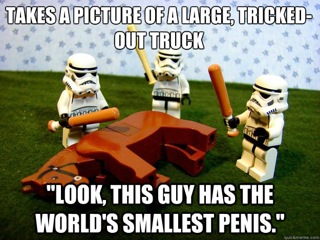 Takes a picture of a large, tricked-out truck 