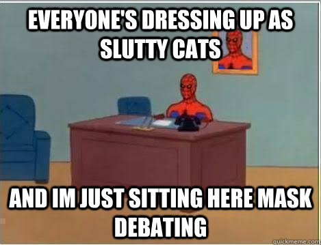 everyone's dressing up as slutty cats and im just sitting here mask debating   Spiderman Desk