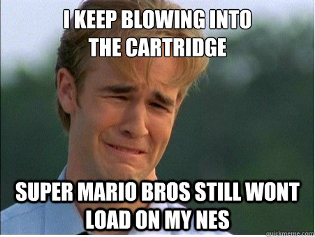 I keep blowing into 
the cartridge Super Mario Bros still wont load on my NES - I keep blowing into 
the cartridge Super Mario Bros still wont load on my NES  1990s Problems