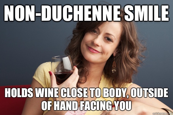Non-Duchenne smile Holds wine close to body, outside of hand facing you  Forever Resentful Mother