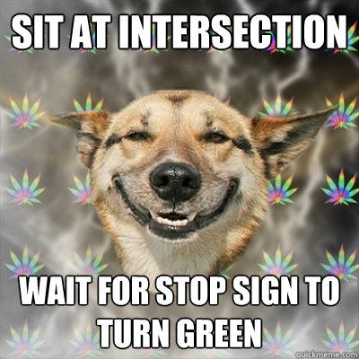 Sit at intersection wait for stop sign to turn green  