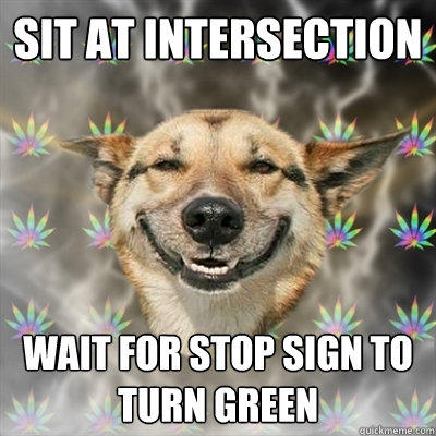 Sit at intersection wait for stop sign to turn green  