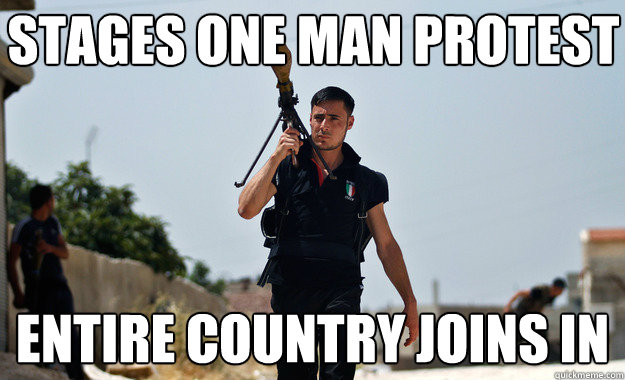 Stages one man protest Entire country joins in  Ridiculously Photogenic Syrian Soldier