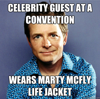 celebrity guest at a convention wears marty mcfly life jacket  Awesome Michael J Fox