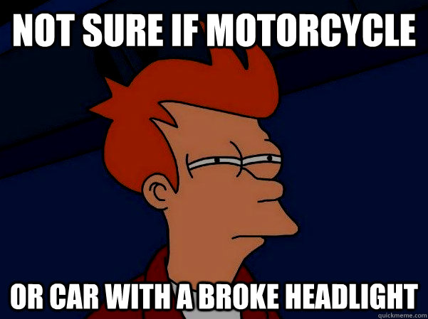 not sure if motorcycle or car with a broke headlight  