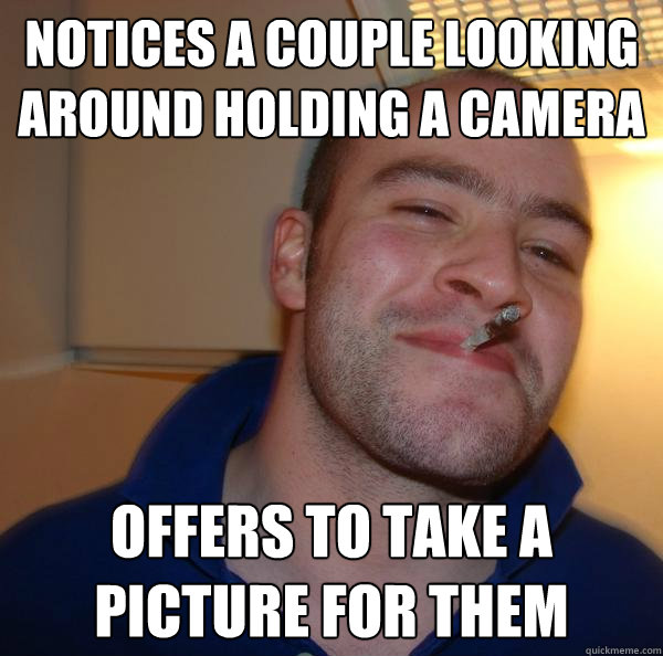 notices a couple looking around holding a camera offers to take a picture for them - notices a couple looking around holding a camera offers to take a picture for them  Misc
