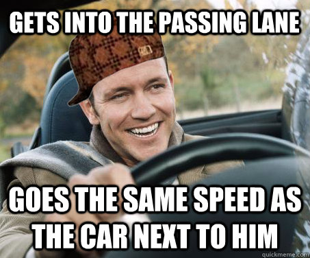 Gets into the passing lane goes the same speed as the car next to him  SCUMBAG DRIVER