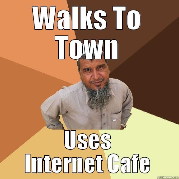 WALKS TO TOWN USES INTERNET CAFE Ordinary Muslim Man