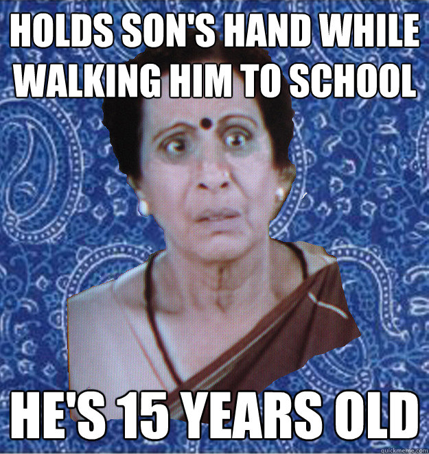 holds son's hand while walking him to school he's 15 years old  