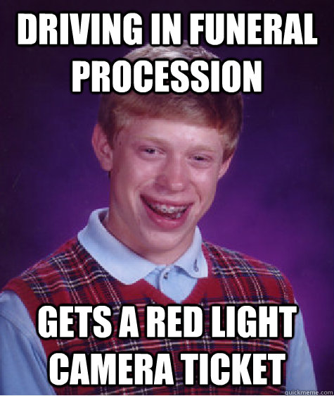 Driving in funeral procession gets a red light camera ticket  - Driving in funeral procession gets a red light camera ticket   Misc